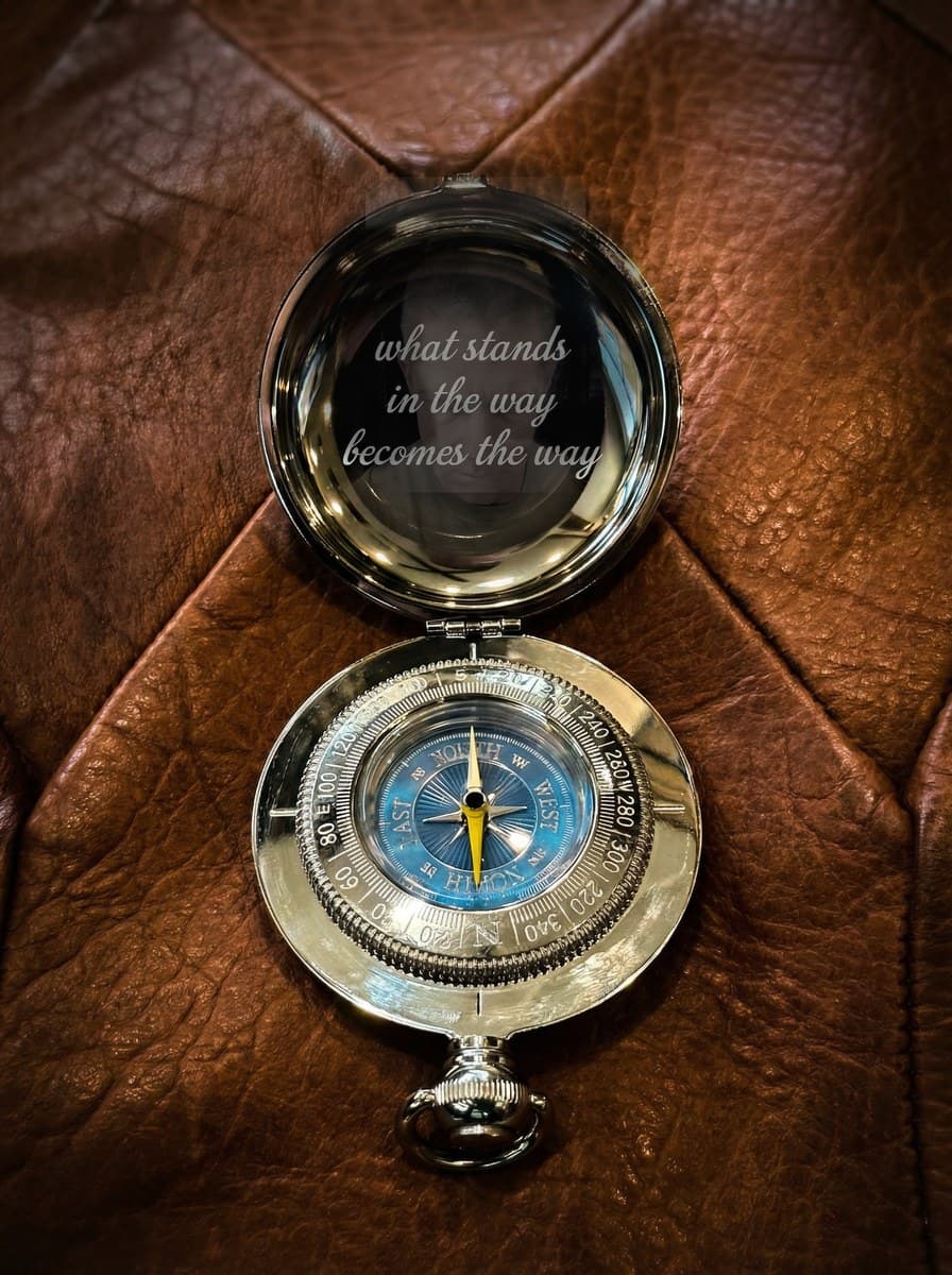 Dalvey compass with 'what stands in the way becomes the way' reflection